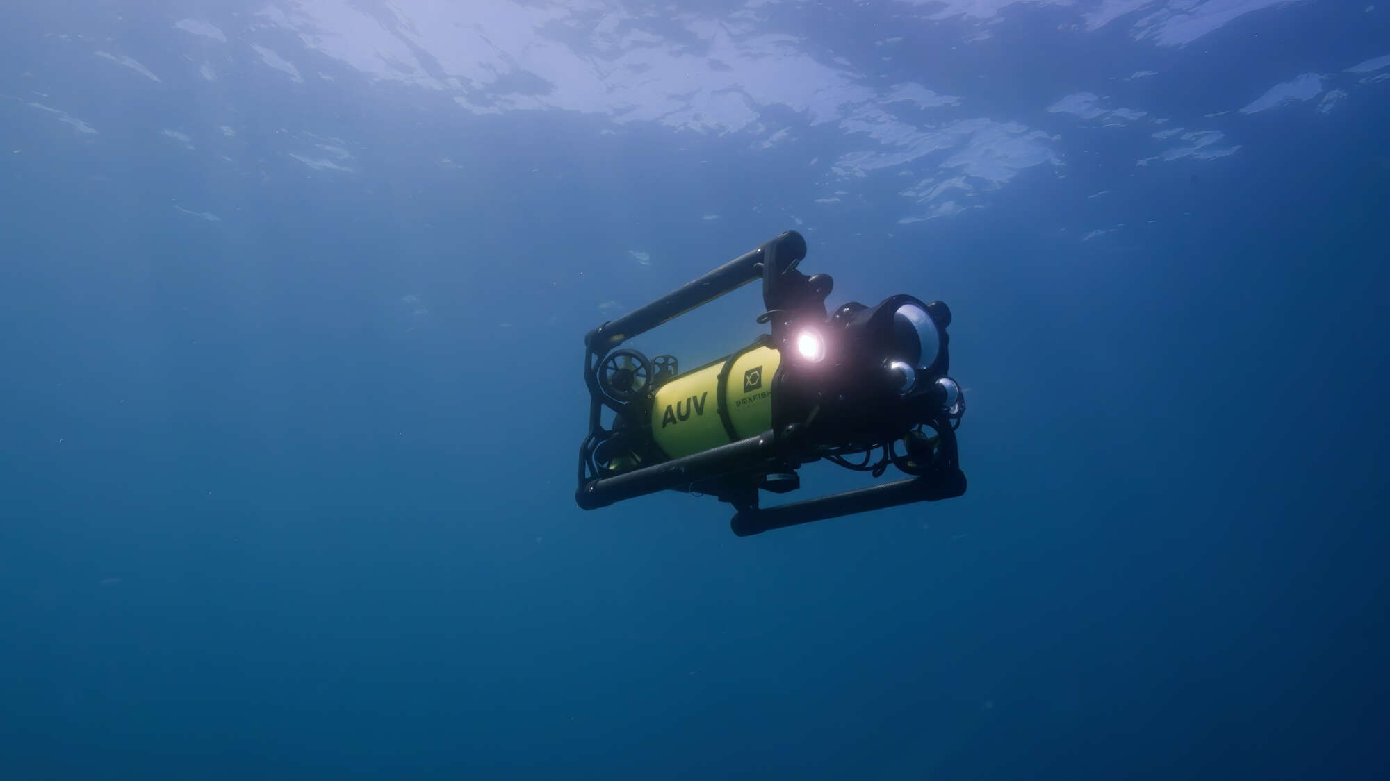 Boxfish AUV underwater with lights on