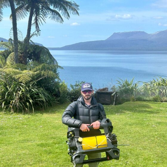 Douglas Grant holding autonomous AUV by Boxfish Robotics